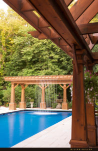 pergola-cascading-waterfall-into-pool